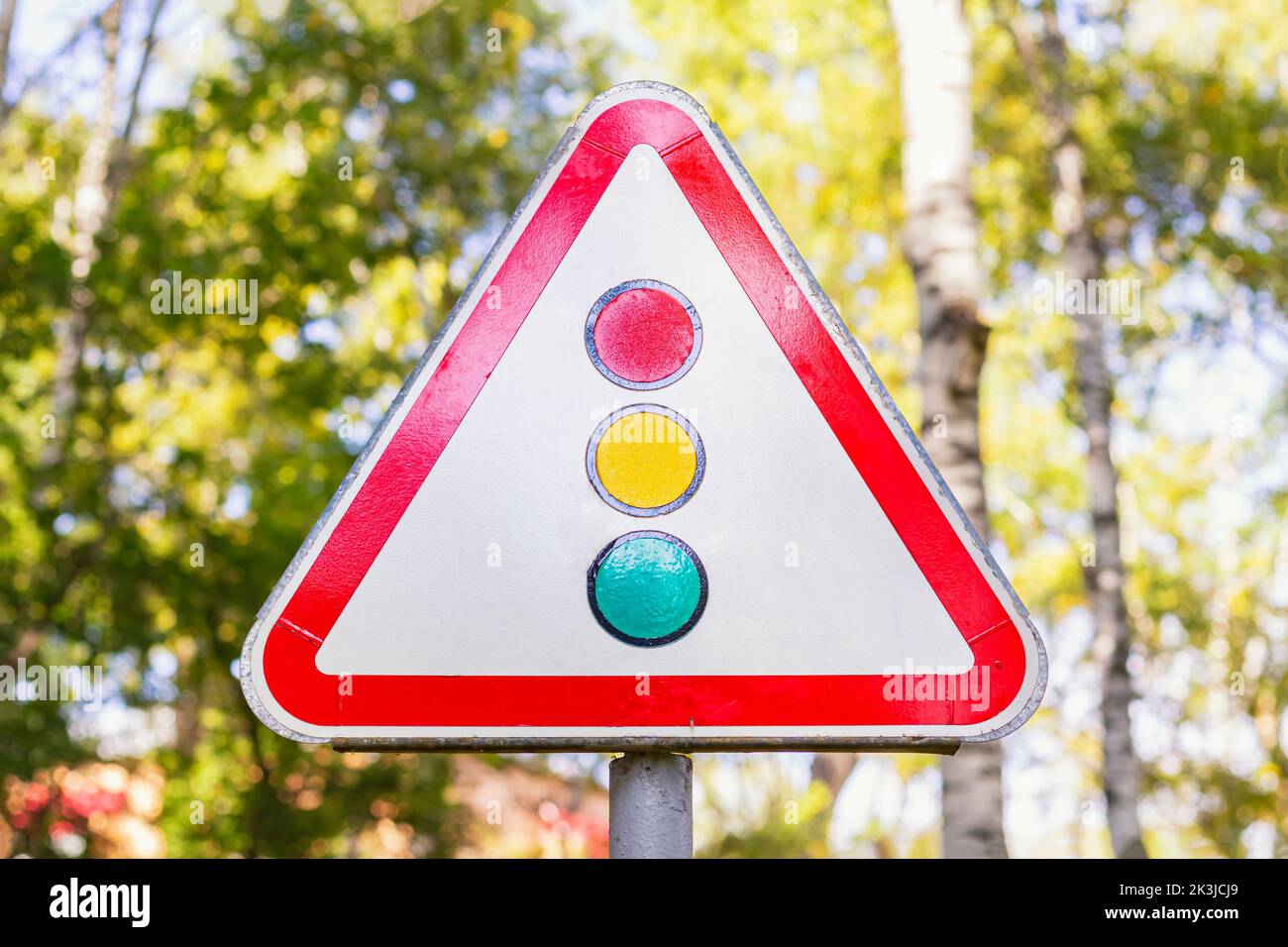 Road sign warning about traffic light regulation of the European standard.German road sign: traffic signals.Traffic signals ahead.Signs giving warning Stock Photo