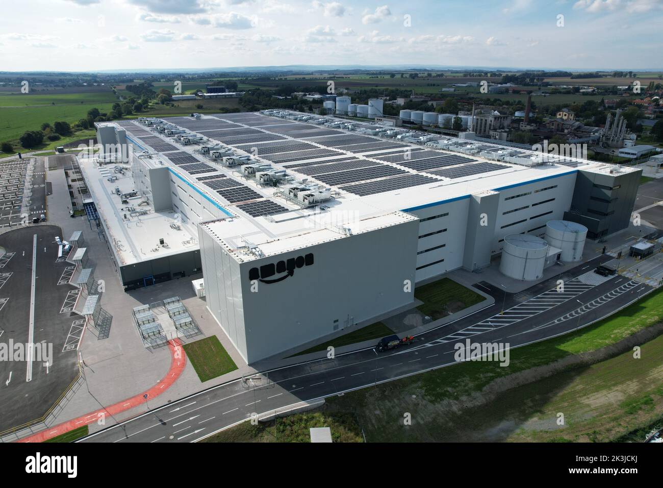 Brand new Amazon Warehouse distribution center. Aerial view of massive sort and distribute logistics center,Eur Amazon warehouse,Kojetin Czech solar p Stock Photo