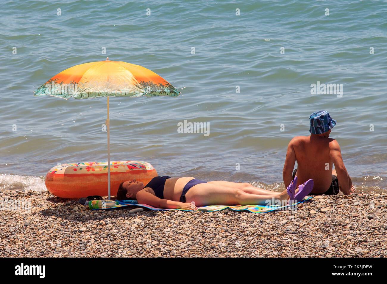Russia Tuapse 08.08.2022 People relax on the beach near the sea in summer Stock Photo