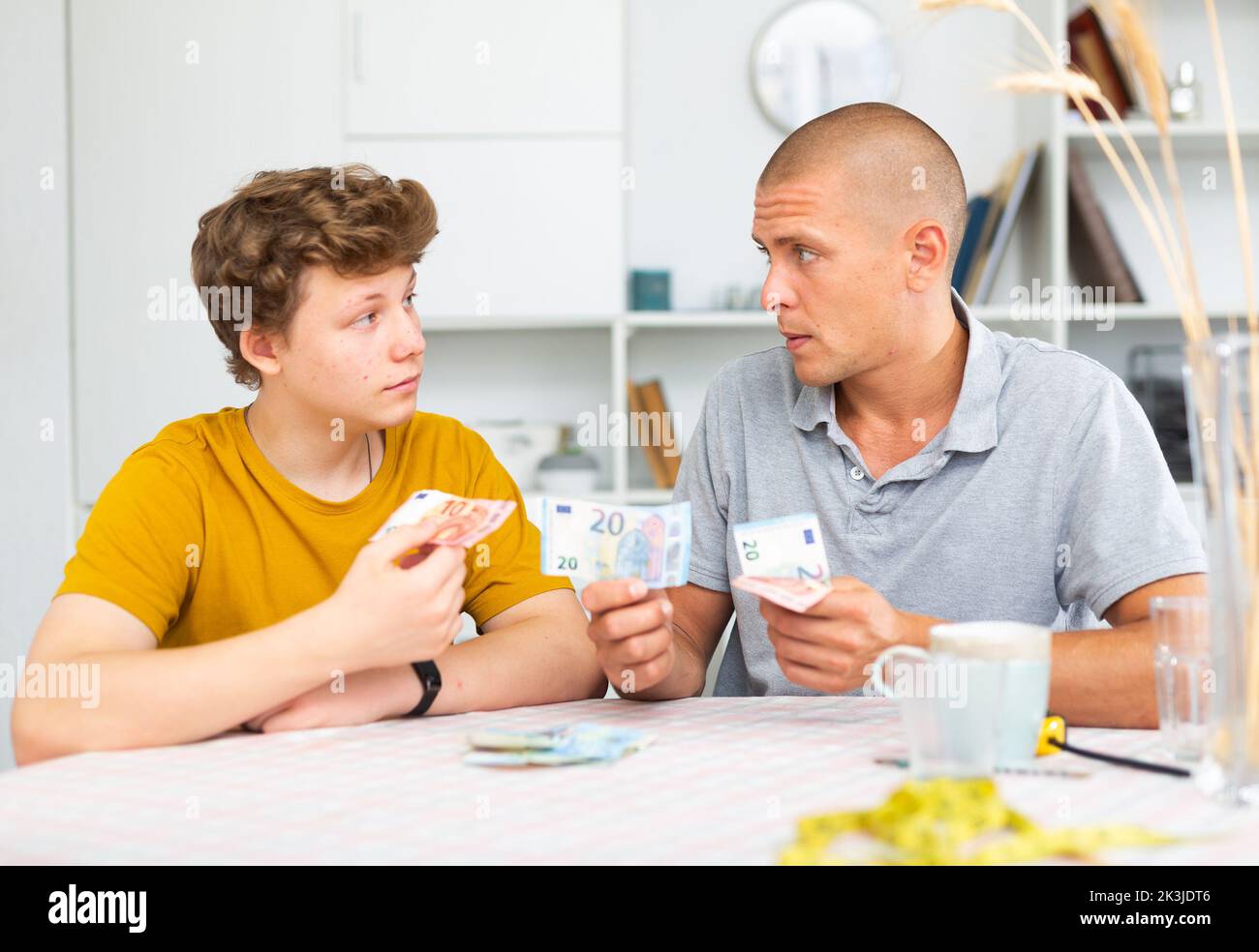 Father and son counting money hi-res stock photography and images - Alamy