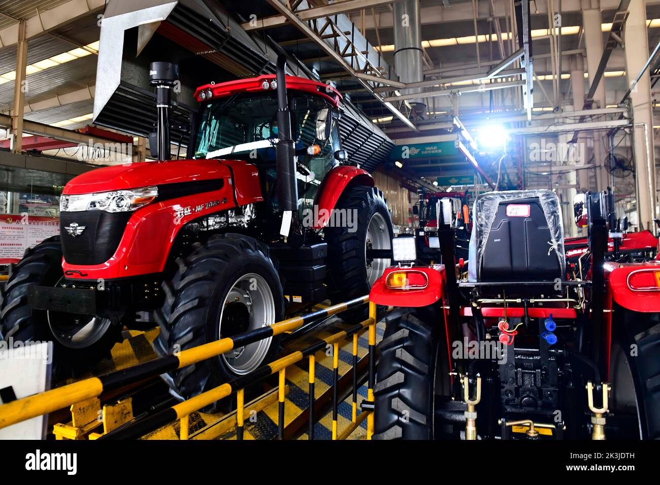 Beijing, China's Shandong Province. 15th Feb, 2022. Staff members work on an assembly line at a farm machinery manufacturing company in Jining City, east China's Shandong Province, Feb. 15, 2022. Credit: Guo Xulei/Xinhua/Alamy Live News Stock Photo