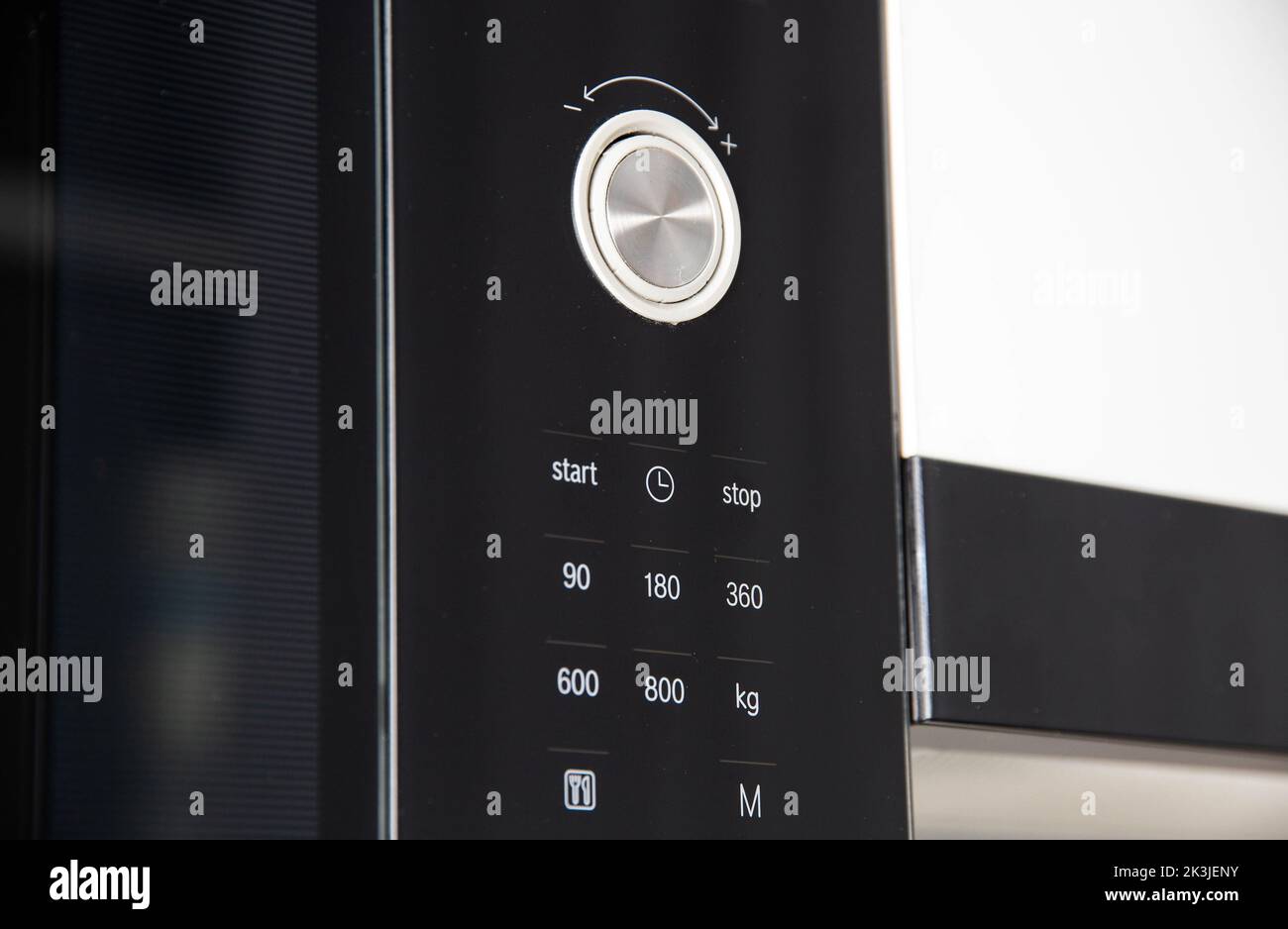 Modern microwave oven touch panel with black glass and time control