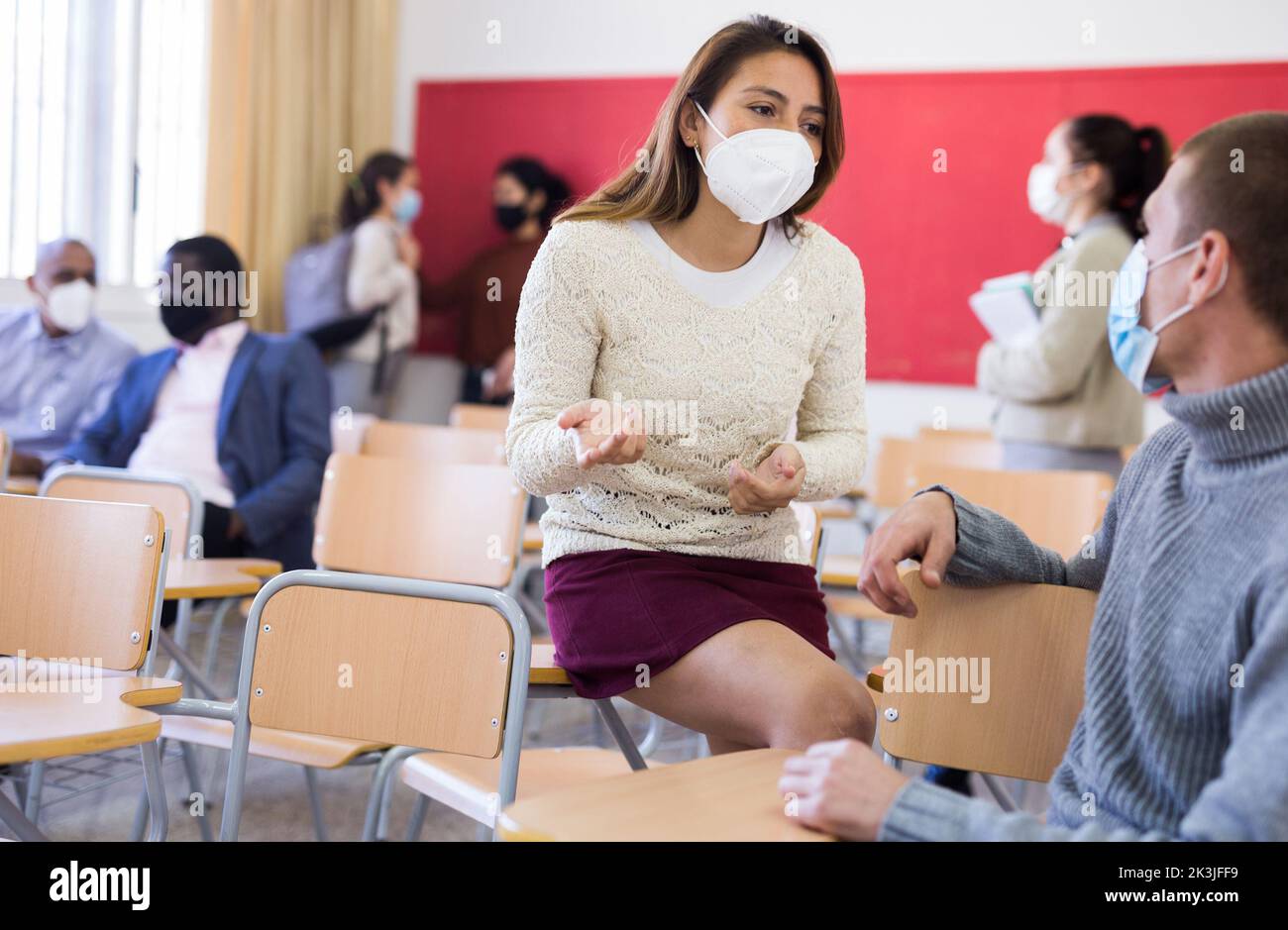 Students wearing protective mask in classroom Stock Photo - Alamy