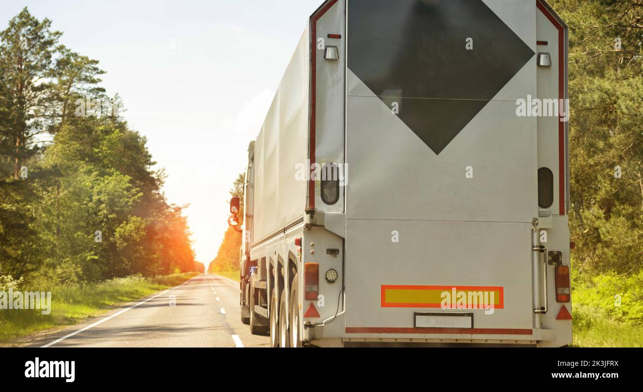 Truck with a special semi-trailer glass carrier. Transportation of glass and double-glazed windows with a large weight, industry Stock Photo