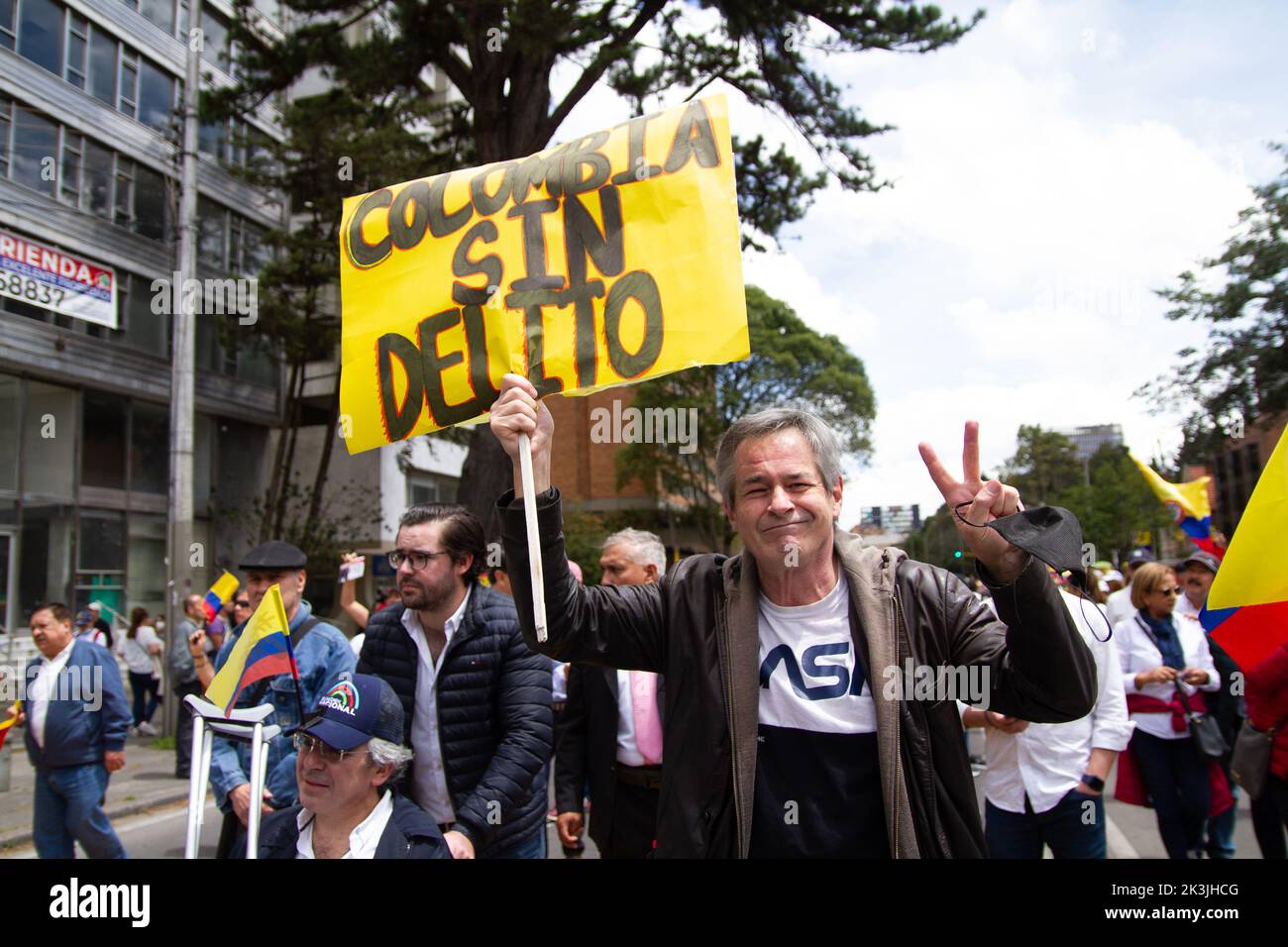 A demonstrator holds a sign that reads 'Colombia without crime' during the first antigovernment protest against left-wing president Gustavo Petro and Stock Photo