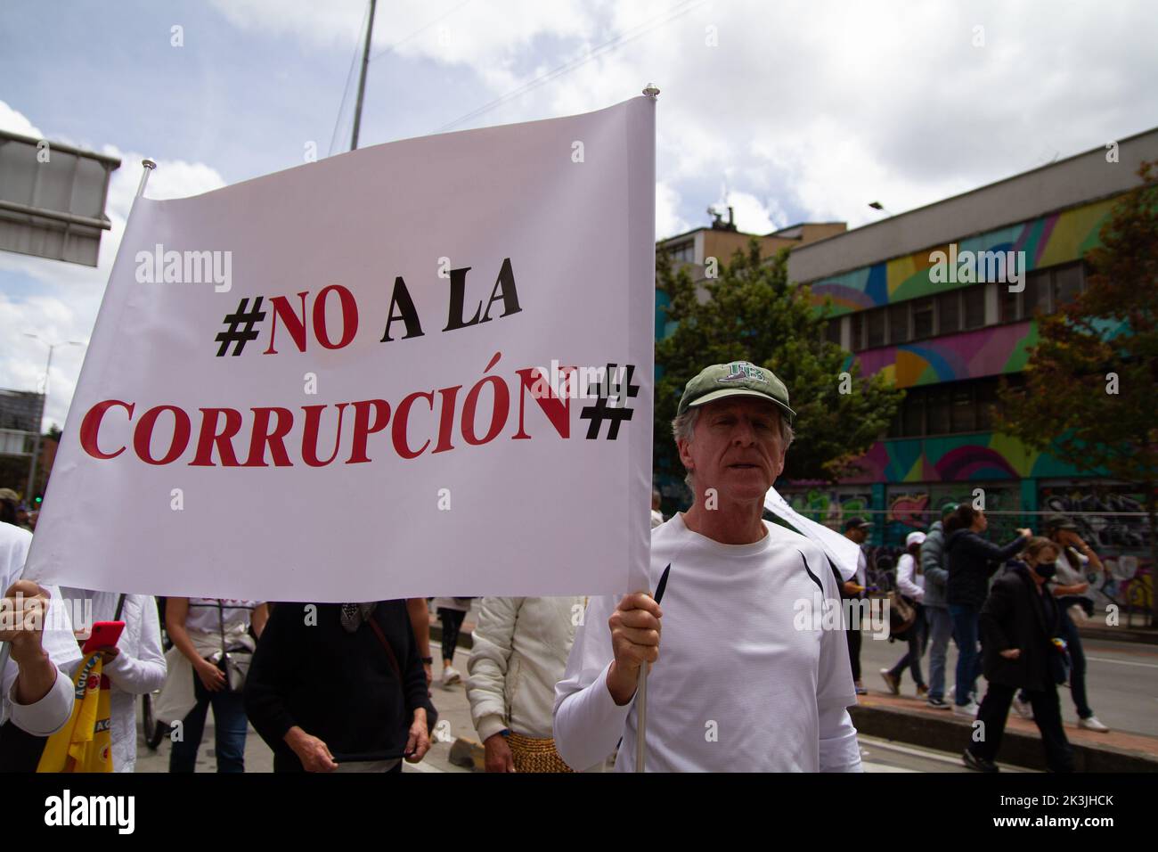 A demonstrator carries a sign that reads 'No to corruption' during the first antigovernment protest against left-wing president Gustavo Petro and his Stock Photo