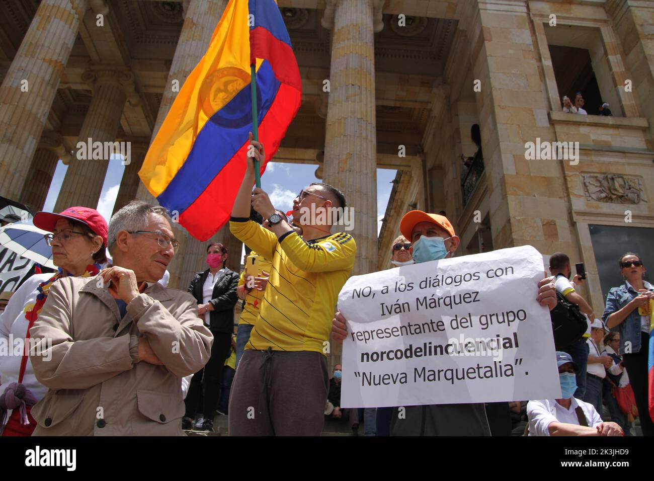 A demonstrator holds a sign against the peace dialogues between the Colombian government and the 'FARC-EP Dissident Groups' during the first antigover Stock Photo