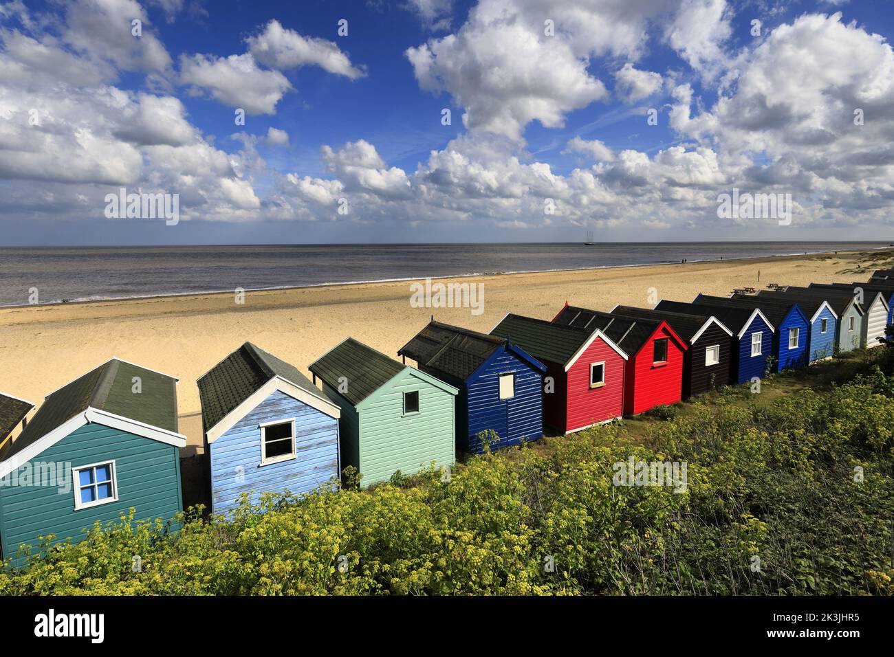 Colourful wooden Beach huts on the promenade, Southwold town, Suffolk, England, UK Stock Photo
