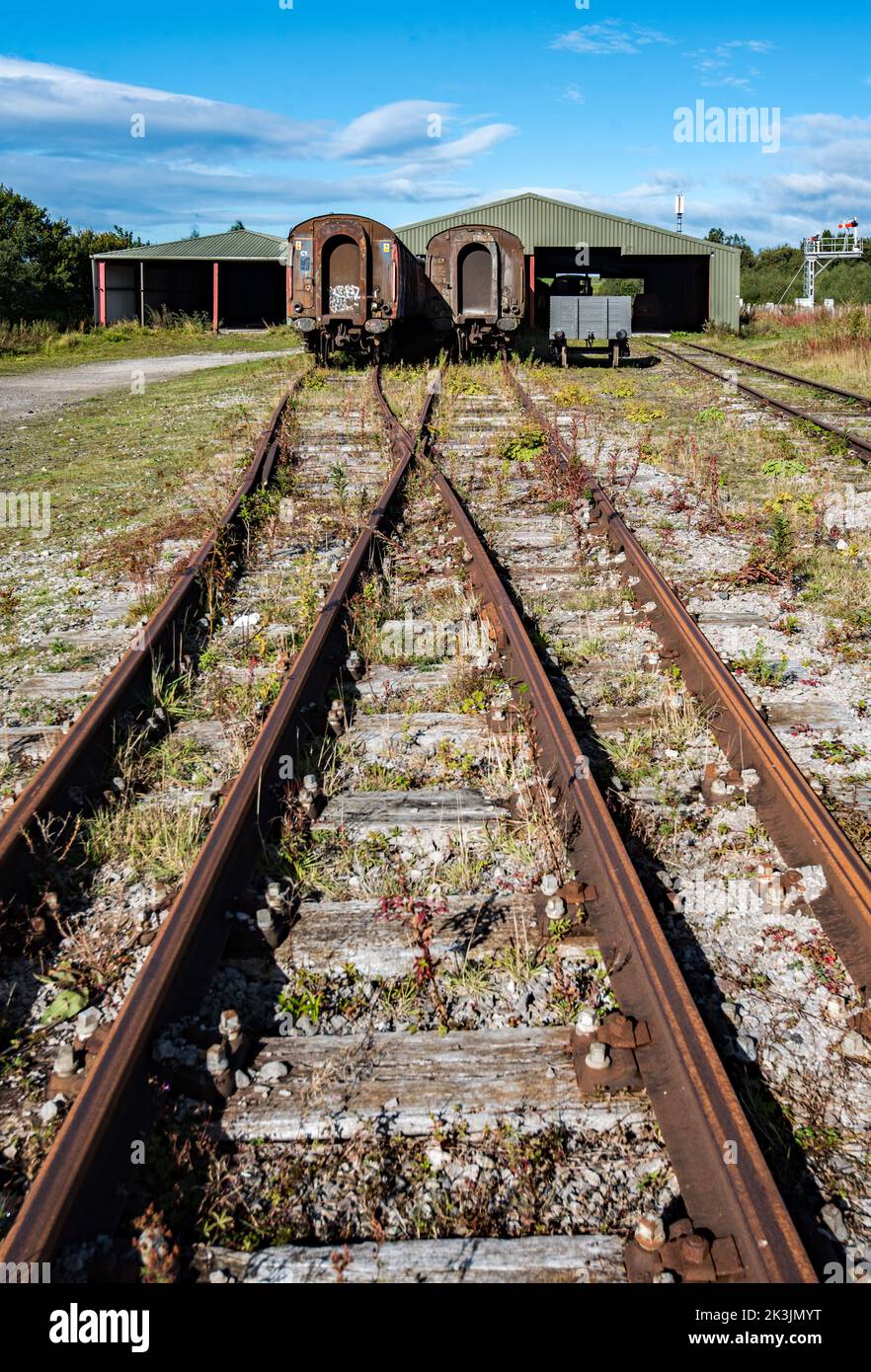 Old carriages at the sheds at Hellifield railway station Stock Photo