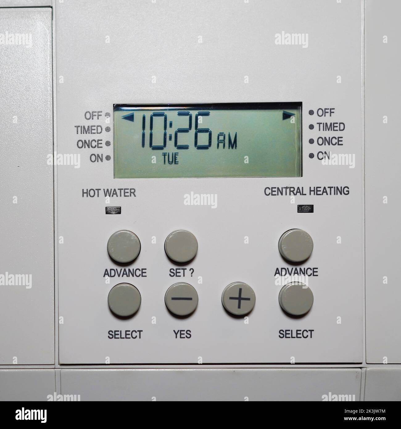 Close up of UK residential gas boiler control panel with timer switches