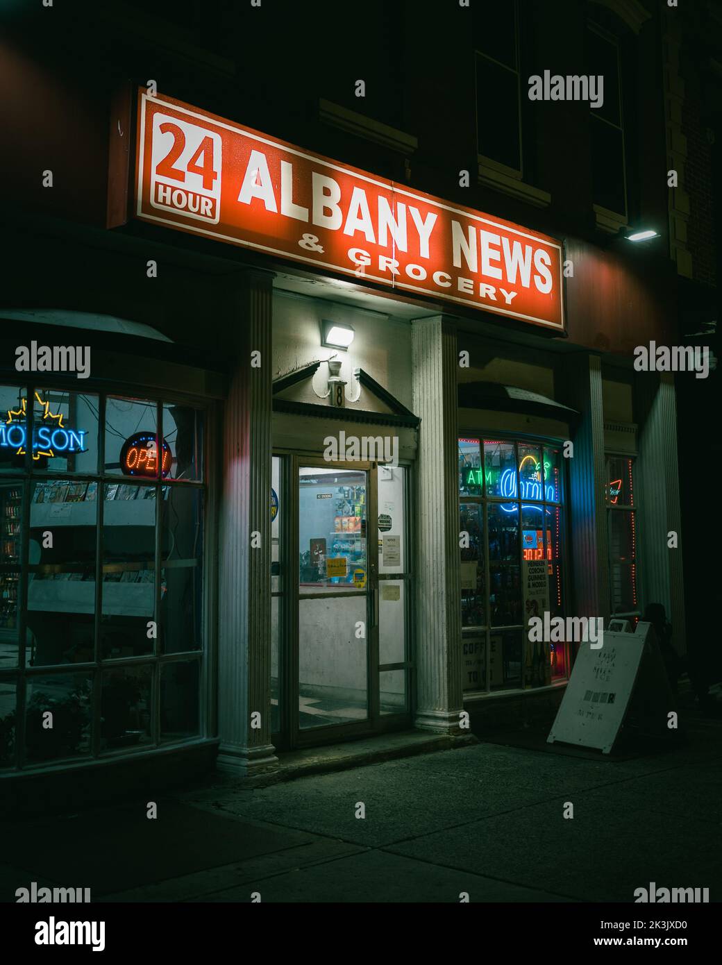 24 Hour Albany News and Grocery sign at night, Albany, New York Stock Photo