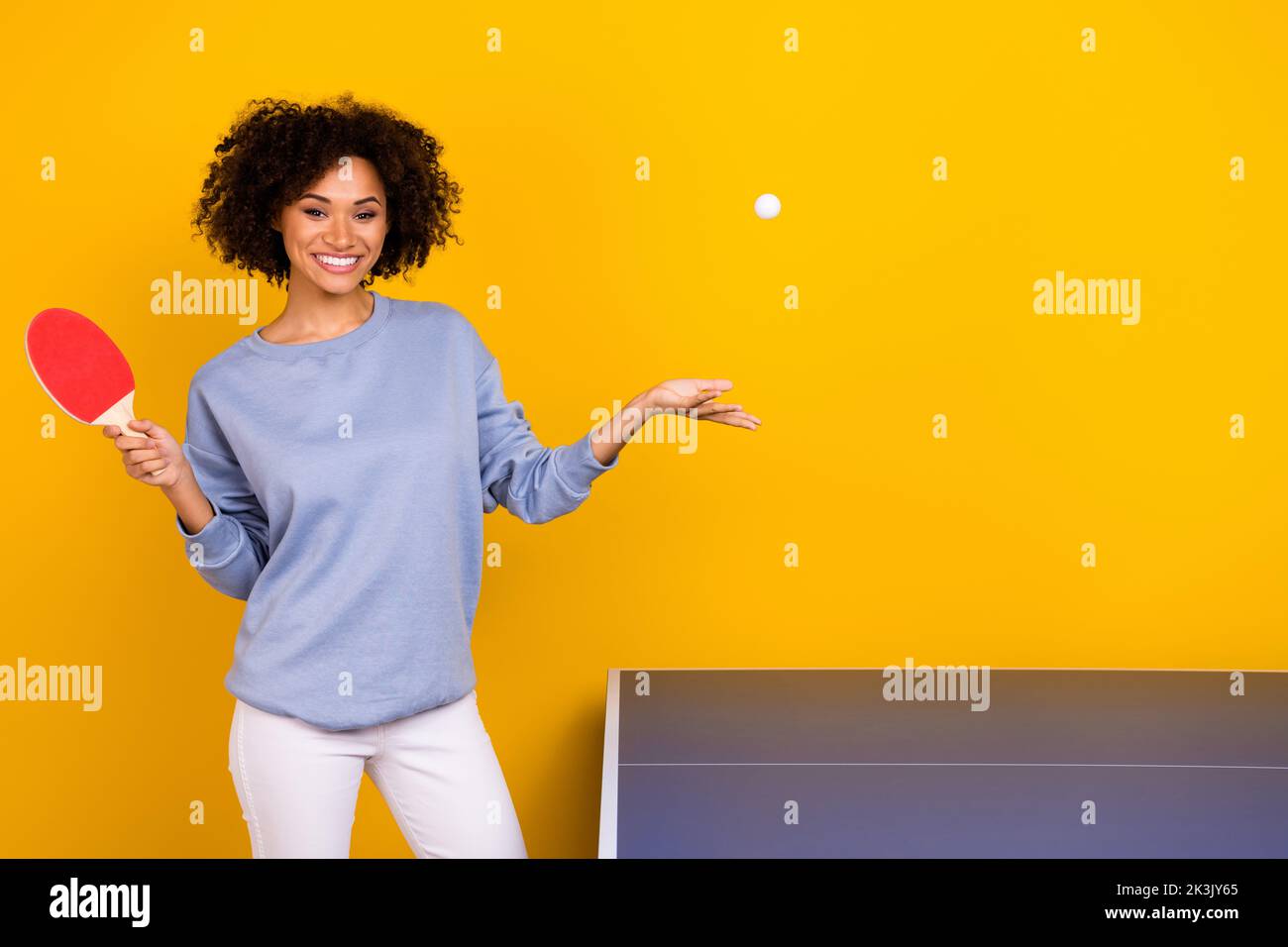 Photo of funny cute curly girl dressed blue pullover throwing ball