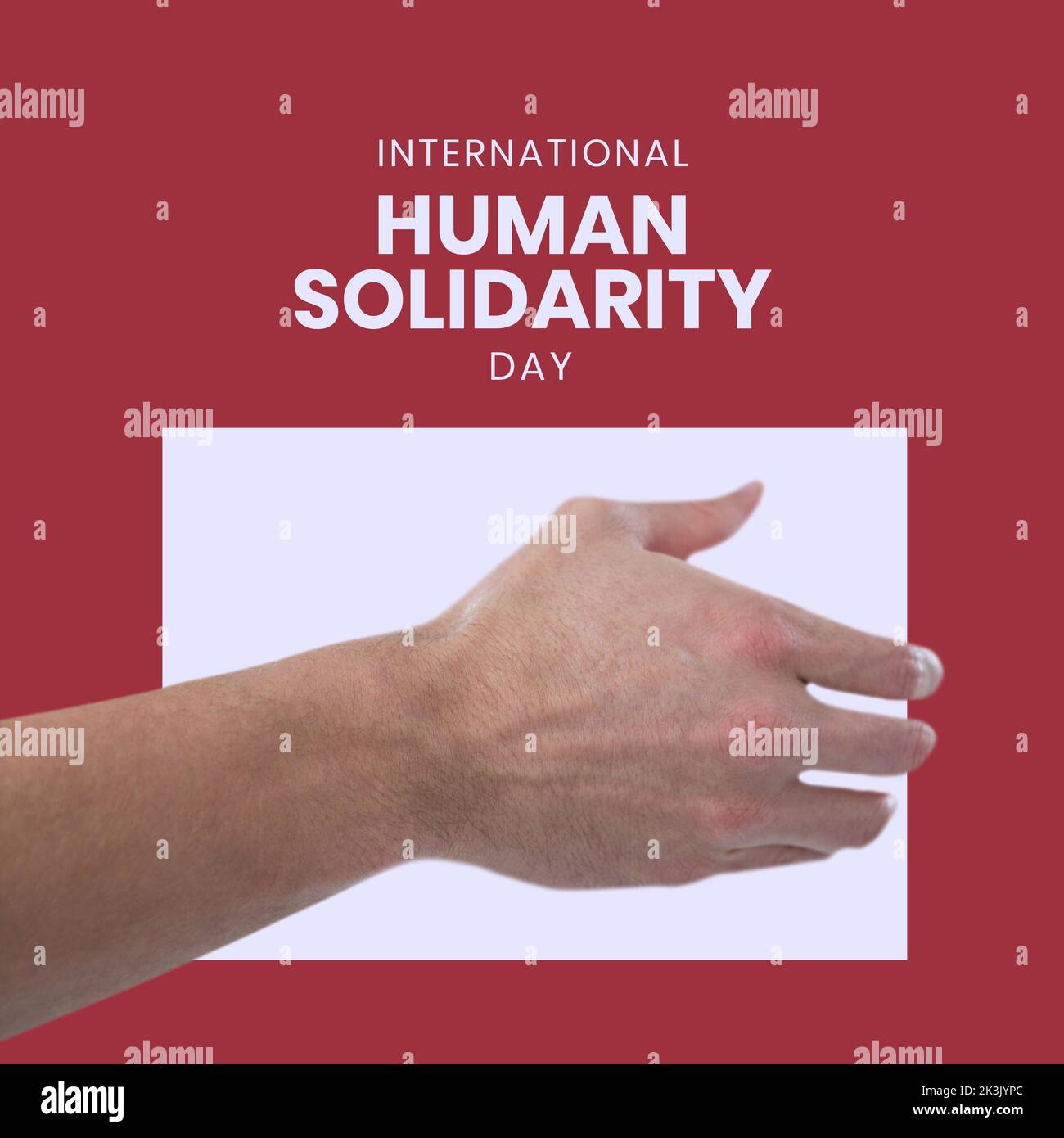 Composition of international human solidarity day text and hand Stock Photo