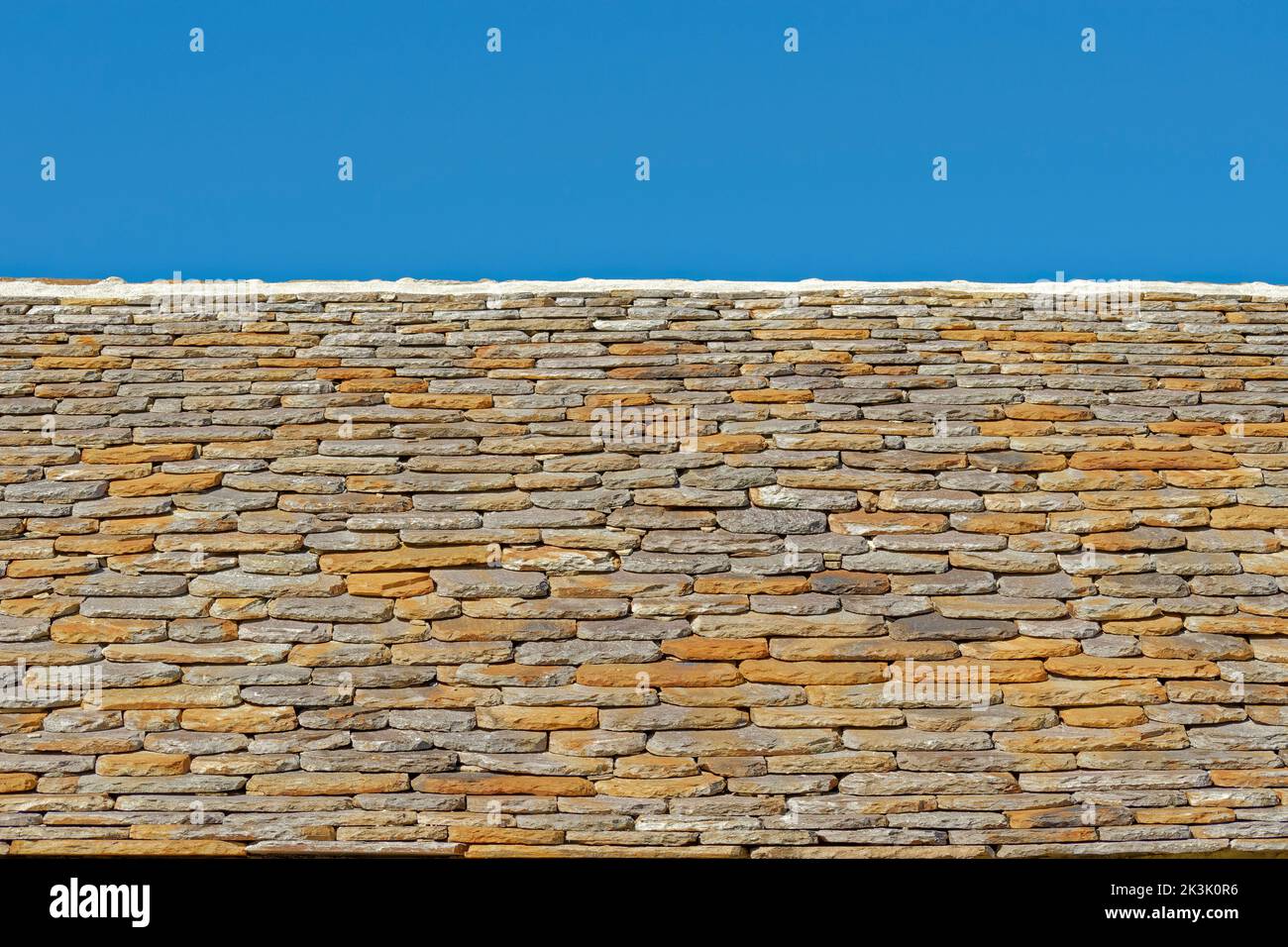 Flat stone roof tiles. Stock Photo
