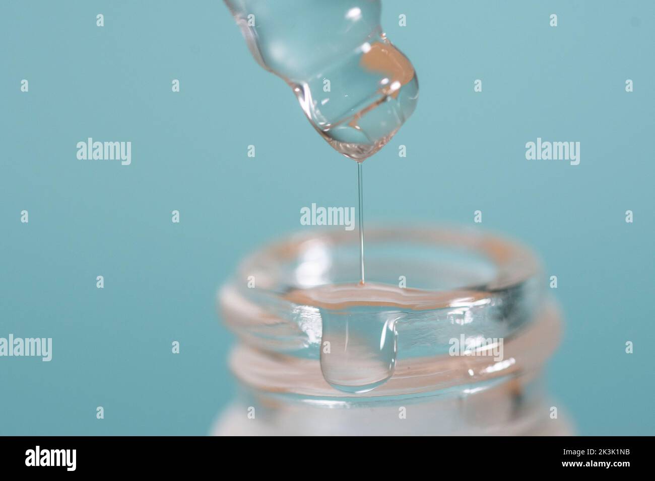 Beauty serum dripping from a pipette Stock Photo Alamy