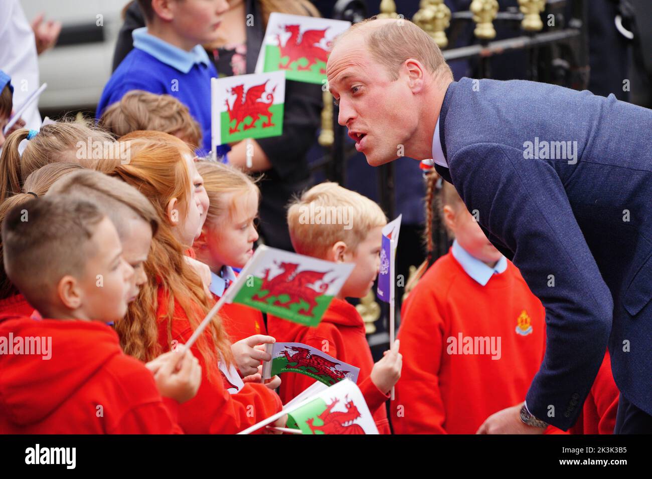 The Prince of Wales speaks to school children as he arrives for a visit to St Thomas Church, in Swansea, Wales. Picture date: Tuesday September 27, 2022. Stock Photo