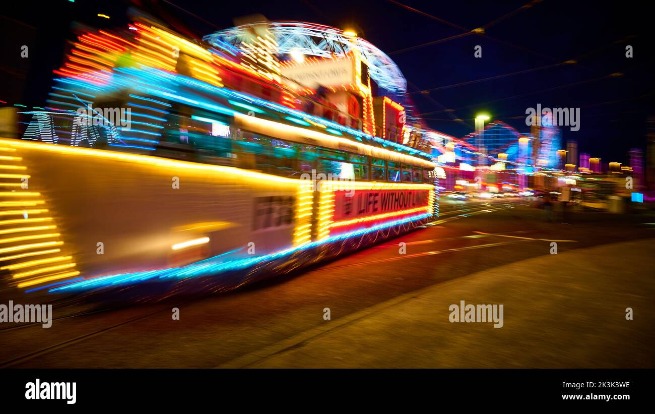Illuminated feature tram passing the Pleasure Beach during the