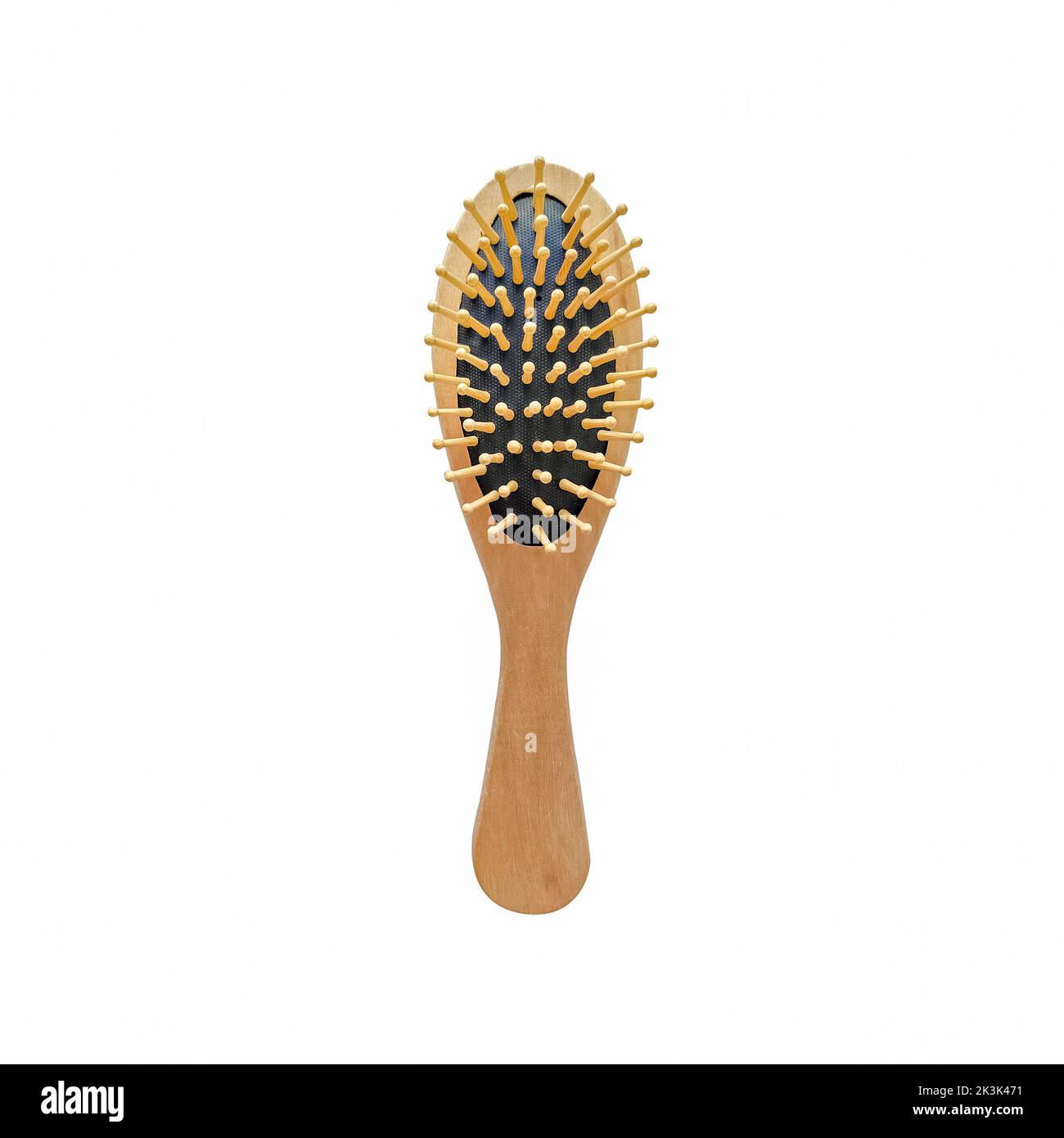 Massage hairbrush. Natural wooden massage comb isolated on white background. Stock Photo