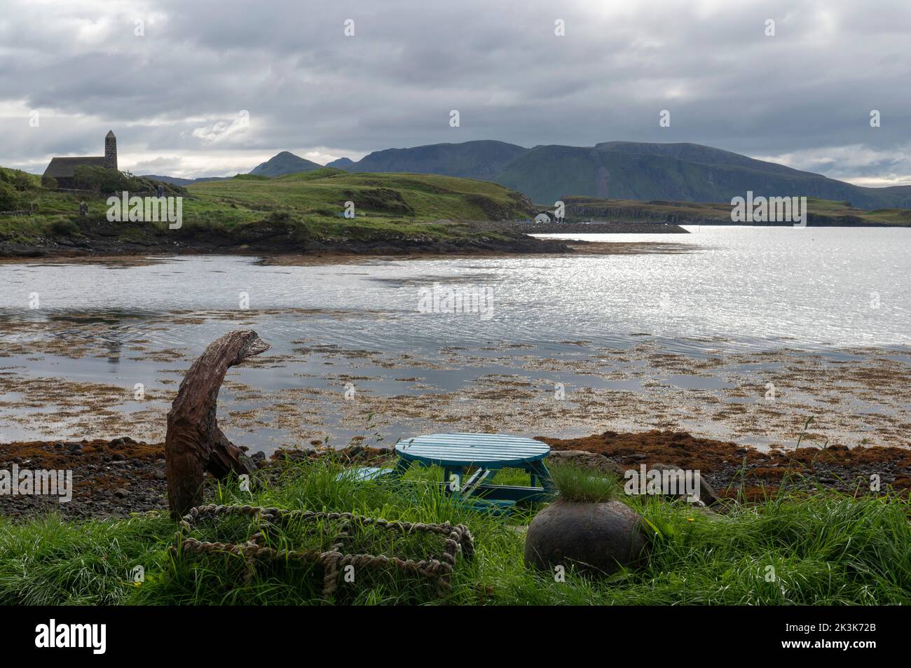September 2022: Isle of Canna, Inner Hebrides, Scotland The view across the bay to Muck from the Canna Cafe. Canna Rhu Church on the left Stock Photo