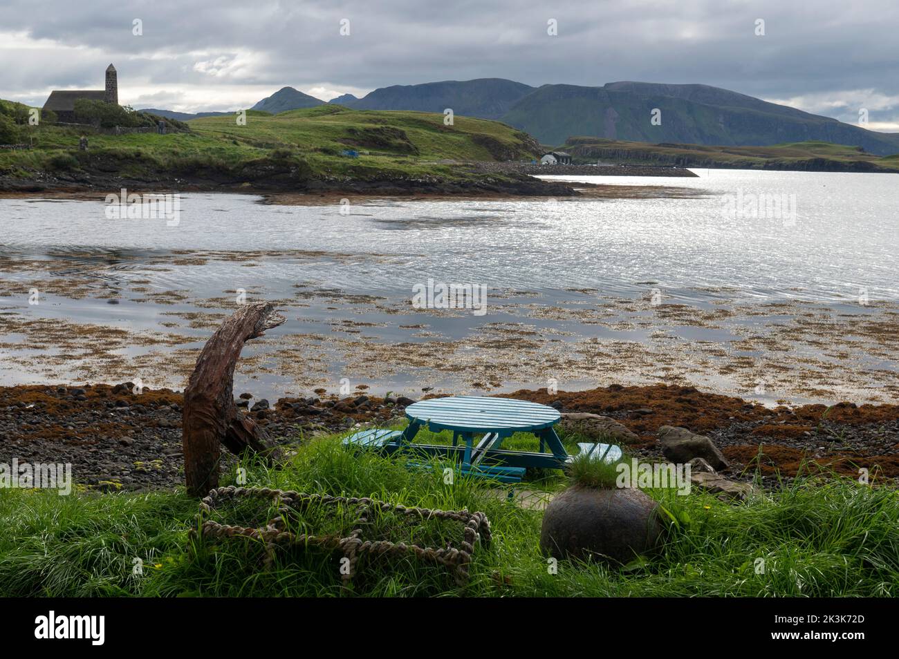 September 2022: Isle of Canna, Inner Hebrides, Scotland The view across the bay to Muck from the Canna Cafe. Canna Rhu Church on the left Stock Photo