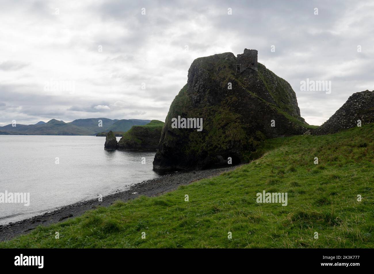 September 2022: Isle of Canna, Inner Hebrides, Scotland Prison Rock and Black Beach From the bend in the road just east of the shop and caf, take the Stock Photo