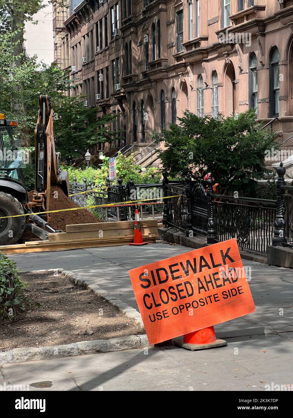 Closed sidewalk during street repair on a residential street in the