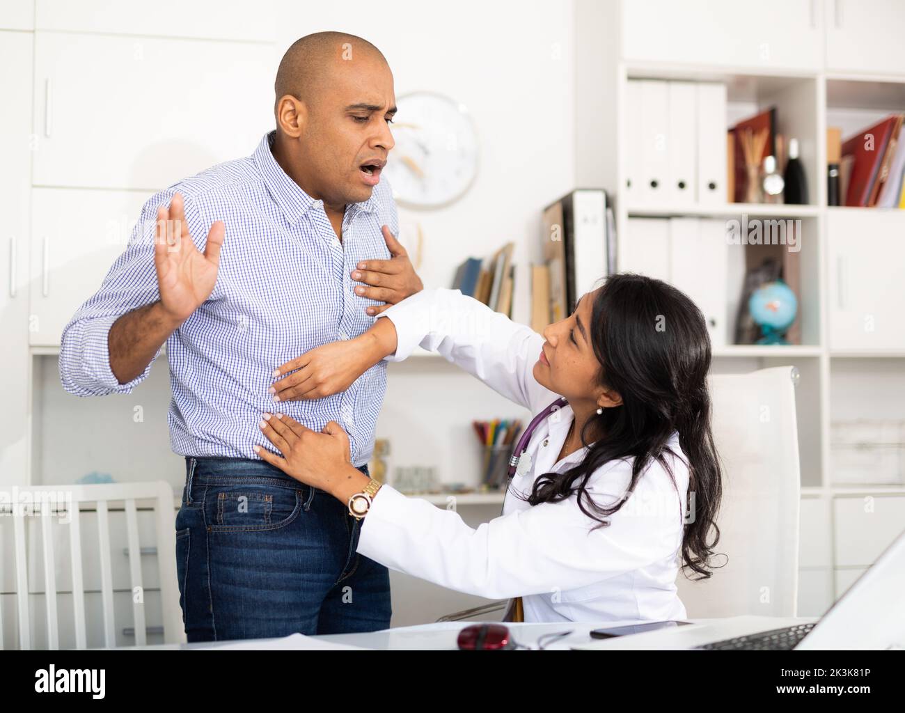 Patient in examination by doctor in clinic Stock Photo