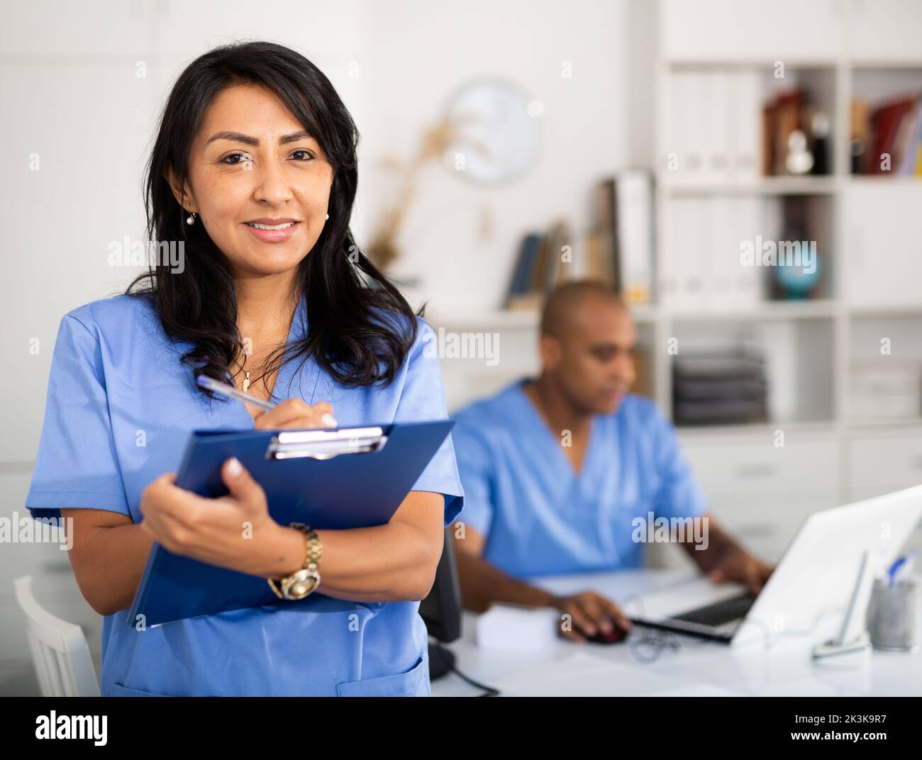 Portrait of female therapist with folder for papers Stock Photo