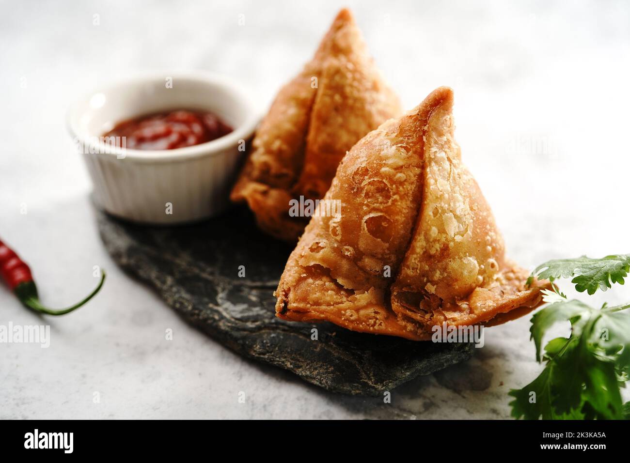 Samosa - Indian triangle pastry with potato filling  Diwali snacks, selective focus Stock Photo