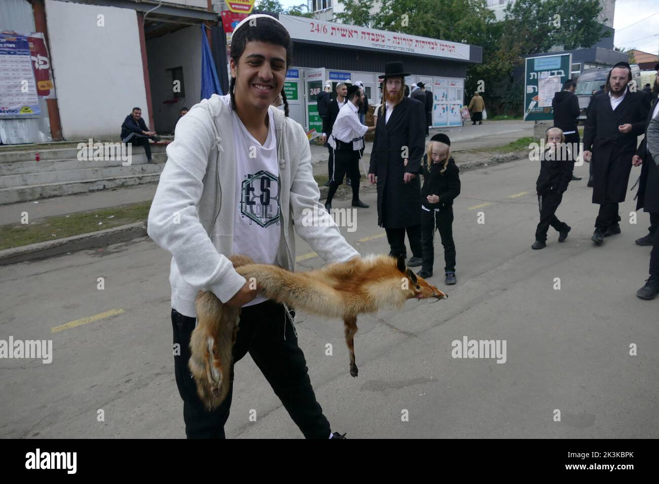 UMAN, UKRAINE - SEPTEMBER 25, 2022 - A Hasidic pilgrim holds the skin ...