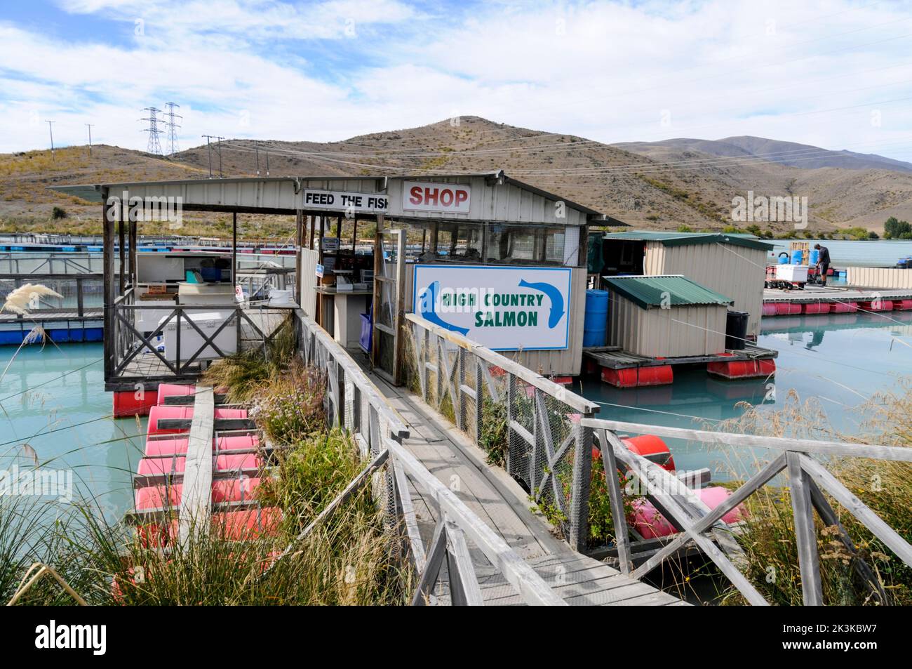A family-run salmon farm, High Country Salmon on the Pukaki-Tekapo canal where visitors can feed the fish in their pens and purchase salmon products s Stock Photo