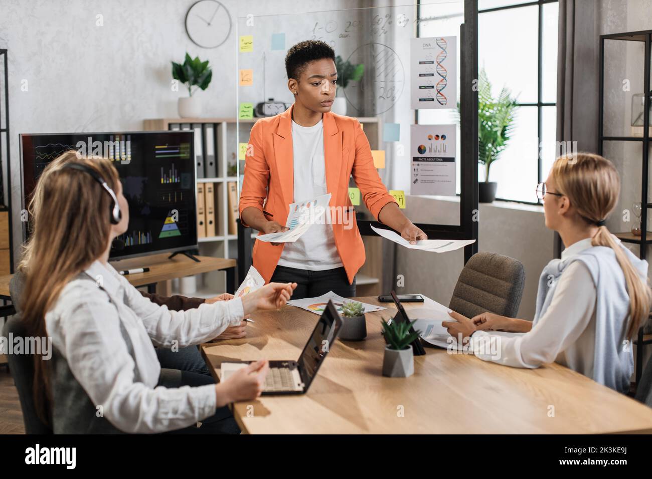 Four multiracial business people in hi-res stock photography and images ...
