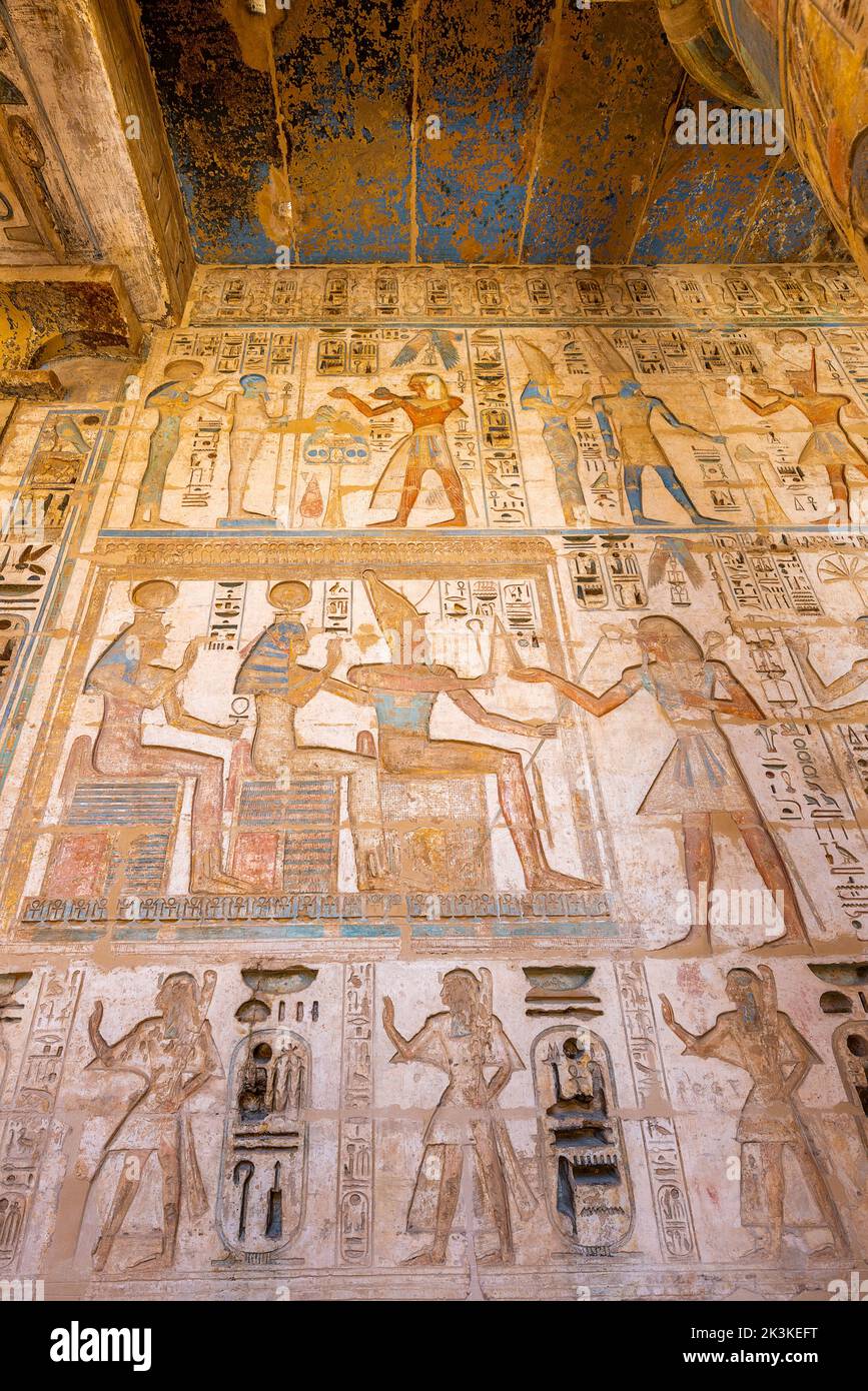 Egyptian hieroglyphs in the Temple of Ramses III, Luxor, Egypt. Stock Photo