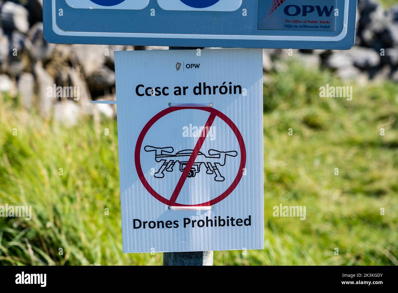 Sign from the Office of Public Works - drones prohibited. The ancient fortress of Dún Aonghasa or  Dún Aengus, Inishmore, the largest of the Aran Isla Stock Photo