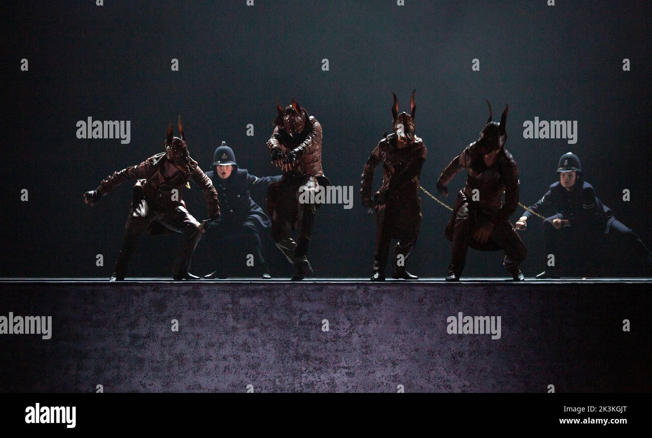 police dogs and handlers in PEAKY BLINDERS: THE REDEMPTION OF THOMAS SHELBY presented by Ballet Rambert at the Birmingham Hippodrome, Birmingham, England  28/09/2022 written & adapted for the stage by Steven Knight  music: Roman GianArthur  music director: Yaron Engler  dramaturgy: Kaite O’Reilly  set design: Moi Tran  costumes: Richard Gellar  lighting: Natasha Chivers  fights: Adrian Palmer  choreographed & directed by Benoit Swan Pouffer Stock Photo