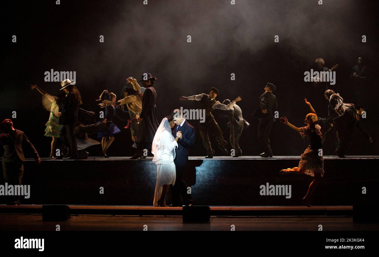 wedding celebration - centre: Naya Lovell (Grace), Guillaume Queau (Thomas Shelby) in PEAKY BLINDERS: THE REDEMPTION OF THOMAS SHELBY presented by Ballet Rambert at the Birmingham Hippodrome, Birmingham, England  28/09/2022 written & adapted for the stage by Steven Knight  music: Roman GianArthur  music director: Yaron Engler  dramaturgy: Kaite O’Reilly  set design: Moi Tran  costumes: Richard Gellar  lighting: Natasha Chivers  fights: Adrian Palmer  choreographed & directed by Benoit Swan Pouffer Stock Photo