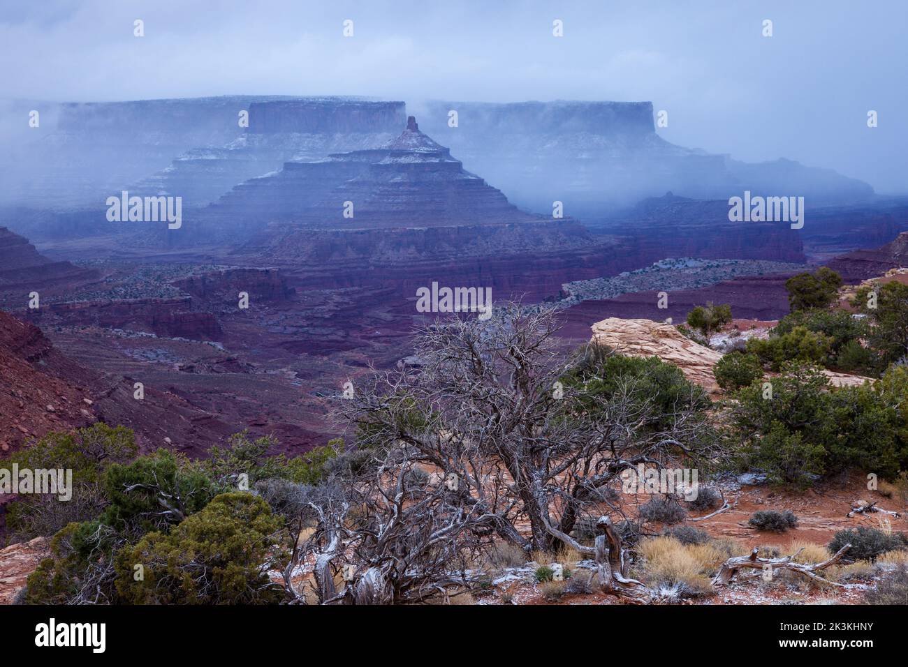 Stormy view of Shafer Canyon & Dead Horse Point from the Shafer Canyon Overlook in Canyonlands National Park, Utah. Stock Photo