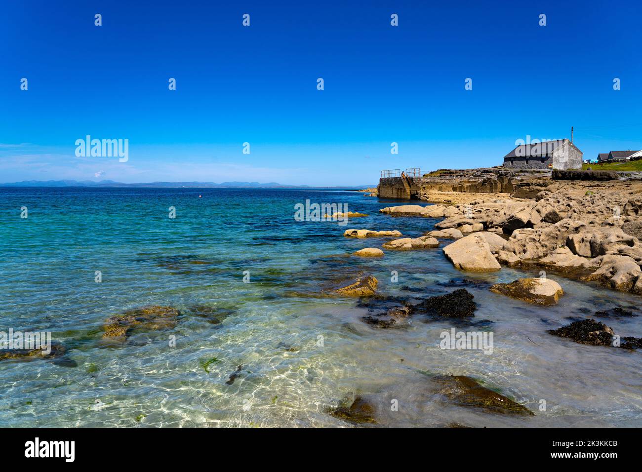 The azure waters of Kilmurvey beach, Inishmore, the largest of the Aran Islands, Galway, Ireland Stock Photo