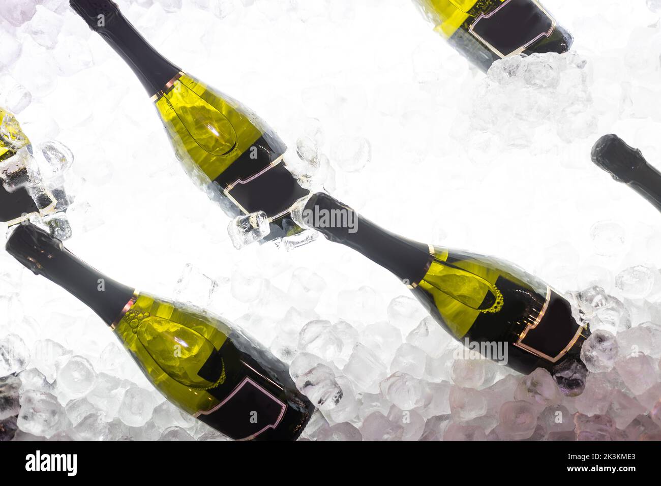 bottles of sparkling wine in ice Stock Photo Alamy