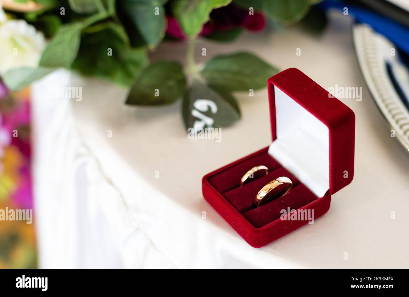 two golden wedding rings in a red box Stock Photo - Alamy