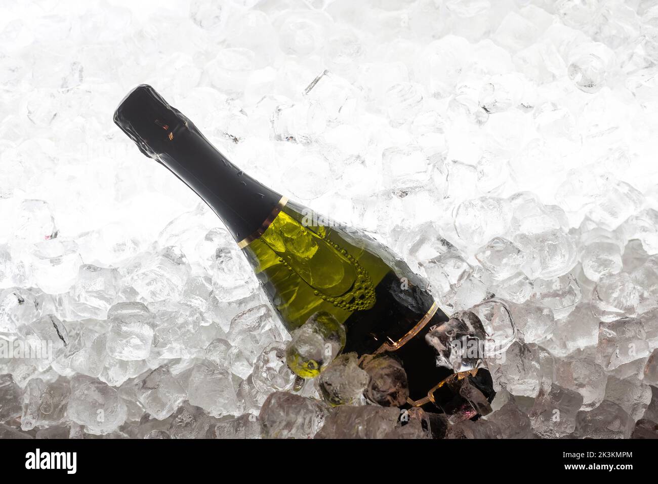 bottles of sparkling wine in ice Stock Photo Alamy