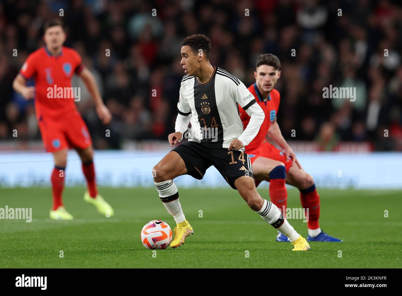 London, UK. 26th Sep, 2022. Jamal Musiala of Germany holds off Declan Rice of England. England v Germany, UEFA Nations league International group C match at Wembley Stadium in London on Monday 26th September 2022. Editorial use only. pic by Andrew Orchard/Andrew Orchard sports photography/Alamy Live News Credit: Andrew Orchard sports photography/Alamy Live News Stock Photo