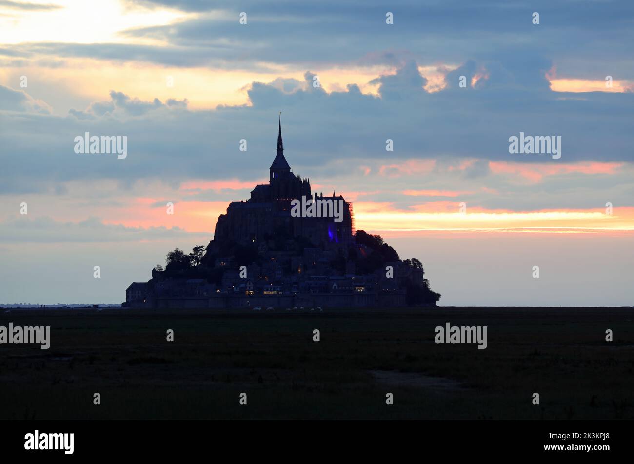 Famous Abbey of Mont Saint Michel in Northern France at Evening in backlit Stock Photo