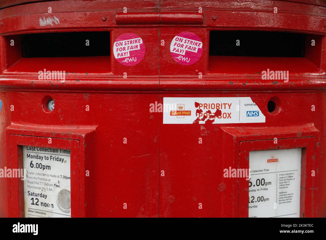 Manchester, UK, 25 Sept 2022: A post box in the Manchester suburb of Chorlton has been decorated with stickers from the CWU (Communication Workers Union) saying 'On strike for fair pay!' Postal workers are due to strike on 30th September and 1st October over fair pay and working conditions. Anna Watson/Alamy Live News Stock Photo