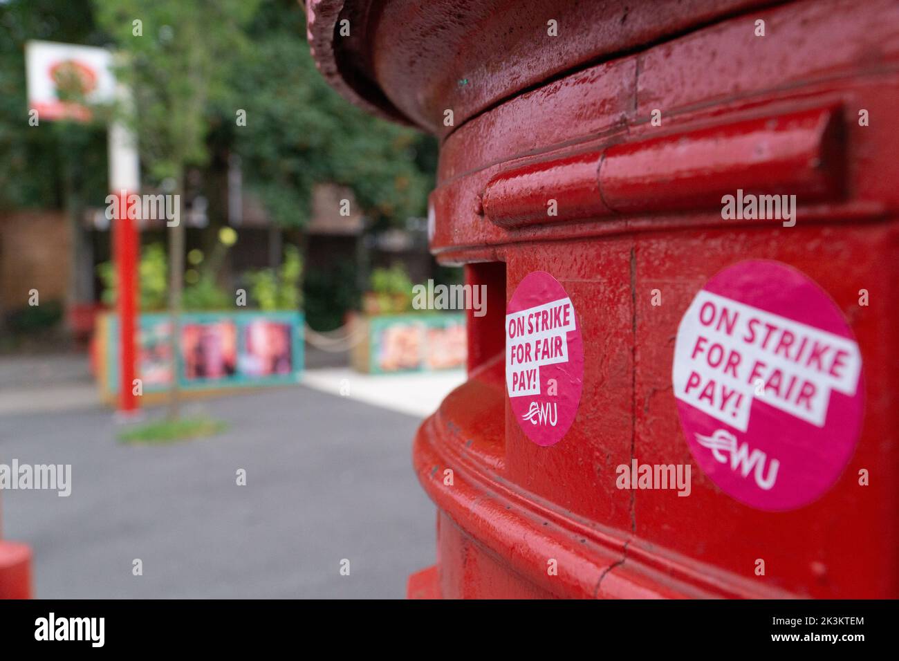 Manchester, UK, 25 Sept 2022: A post box in the Manchester suburb of Chorlton has been decorated with stickers from the CWU (Communication Workers Union) saying 'On strike for fair pay!' Postal workers are due to strike on 30th September and 1st October over fair pay and working conditions. Anna Watson/Alamy Live News Stock Photo