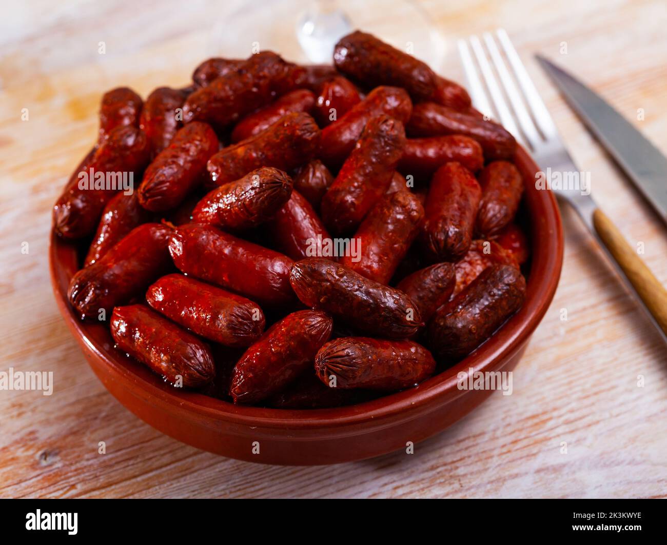 Spanish appetizer, warm mini chorizo sausages Stock Photo Alamy