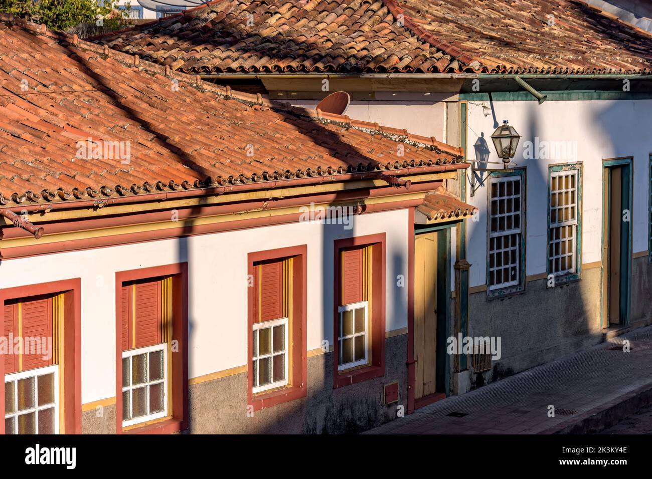 Detail of colonial style streets and houses in the old and historic city of Diamantina in Minas Gerais, Brazil during the late afternoon Stock Photo