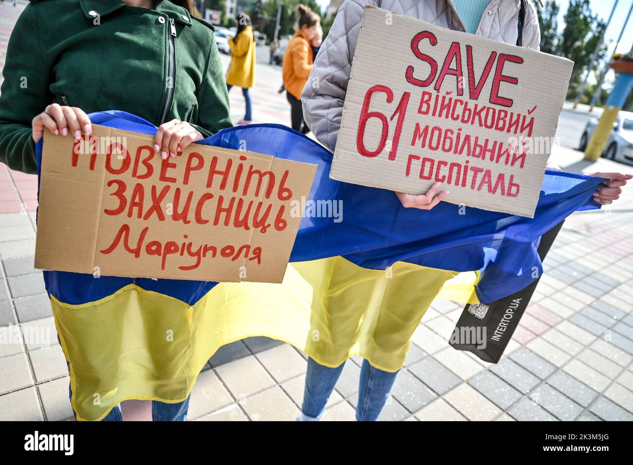 ZAPORIZHZHIA, UKRAINE - SEPTEMBER 25, 2022 - Activists hold placards calling for the release of Mariupol defenders and civilians who are currently in Stock Photo