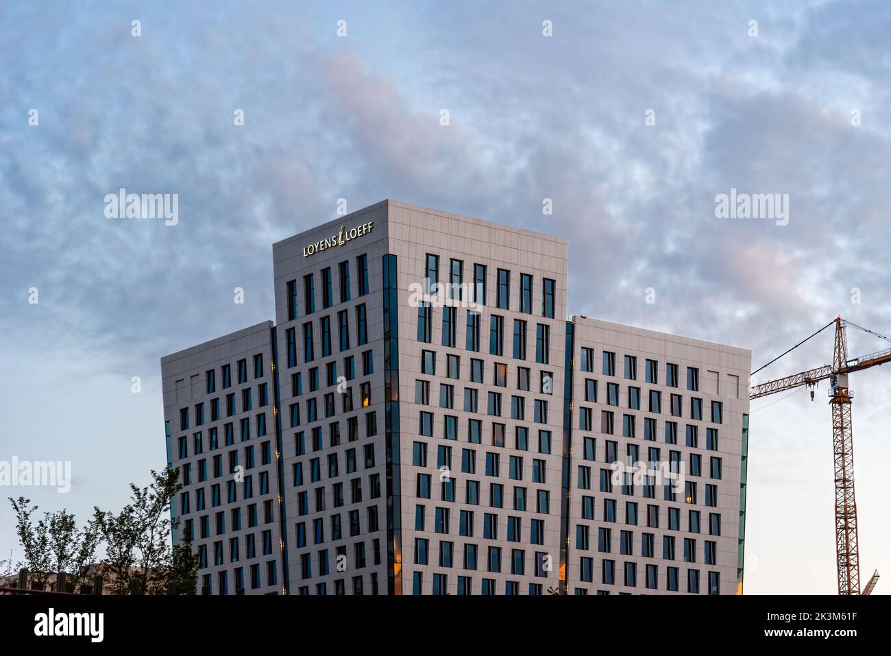 Amsterdam, Netherlands - May 7, 2022: Low angle view of futuristic architecture skyscraper against sky. Loyens and Loeff lawyer and legal services fir Stock Photo