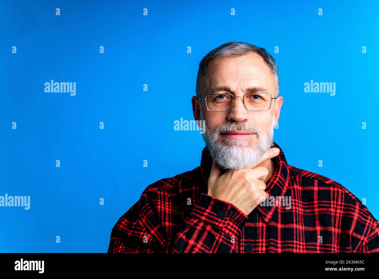old good looking man making important life choices blue backgrond